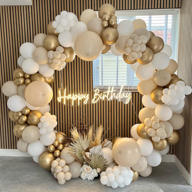 Gold and white balloon arch birthday decoration with happy birthday neon sign in Singapore